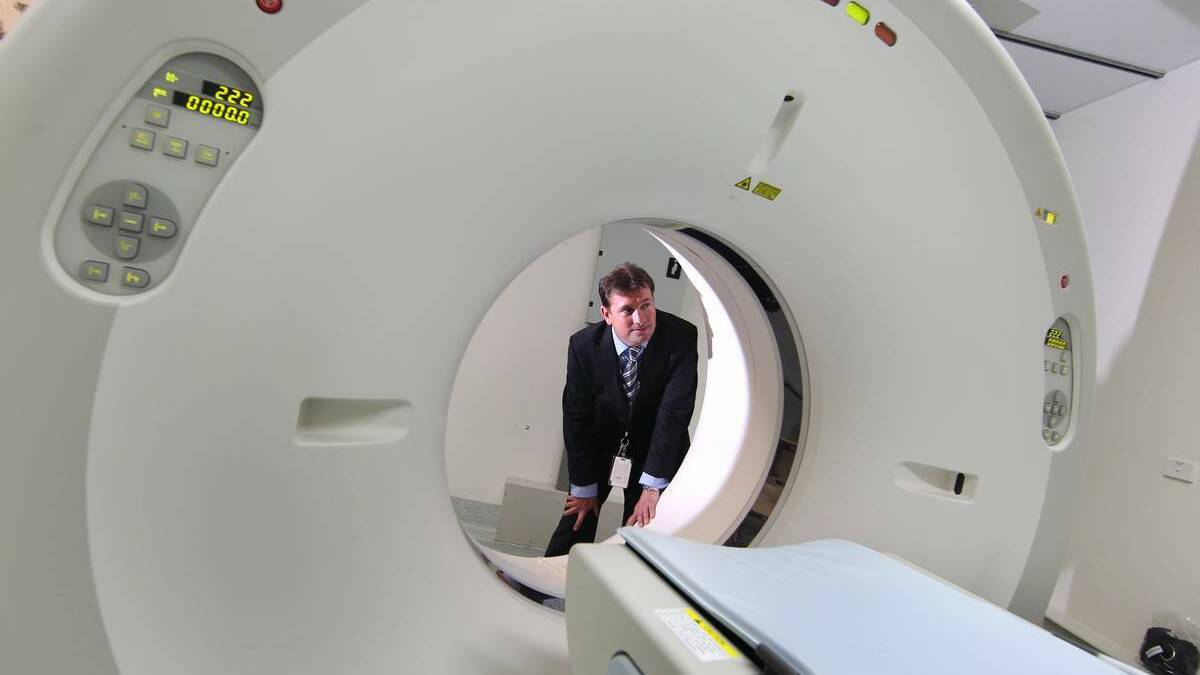 Operations Manager Forensic Medicine Scott Pearce with CT scanner which has been installed at the Department of Forensic Medicine at Newcastle.
Photo by PHIL HEARNE. 