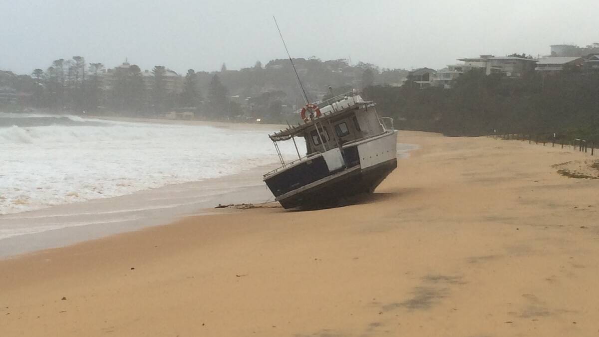 A boat washes ashore at Terrigal. Pic: Joanne McCarthy