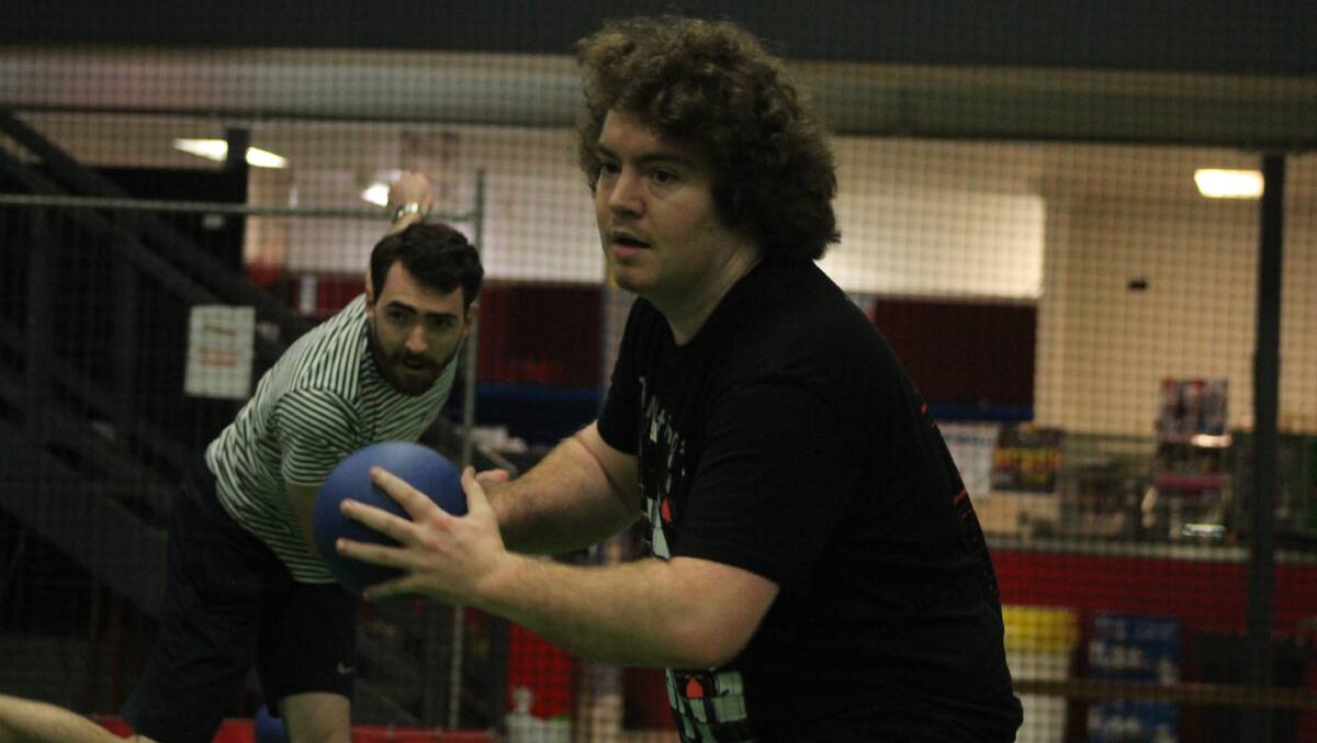VETERANS: Thomas McCallum and Lachlan Craig counter-attack late on in the 9-5 victory for Hamilton that booked their position in the Newcastle Dodgeball League grand final.