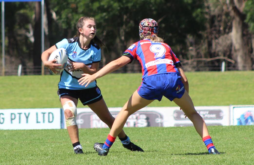 TOP RAKE: Olivia Glanville, pictured defending against the Cronulla Sharks earlier in the season, will look to make a major impact in the third week of the TG Cup finals.