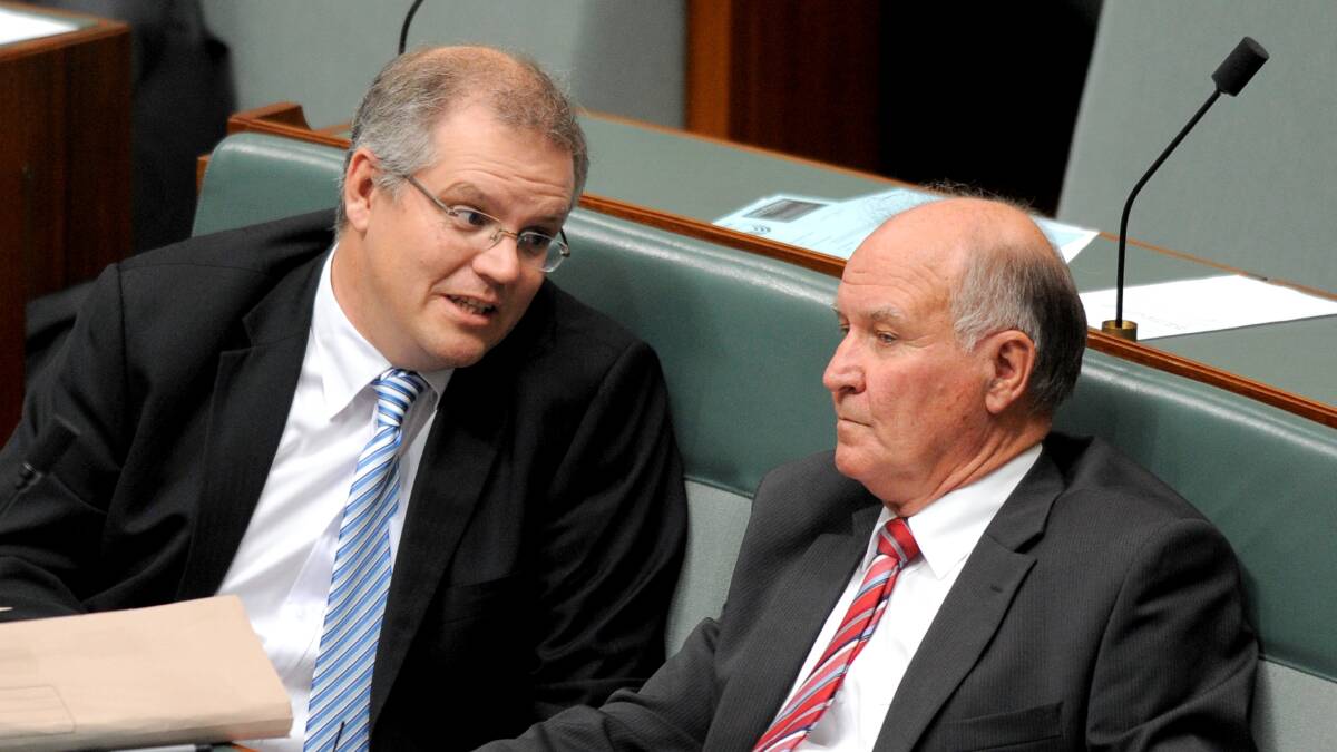 Scott Morrison (left), then shadow immigration minister, speaks to independent MP Tony Windsor in September 2011. Picture: AAP