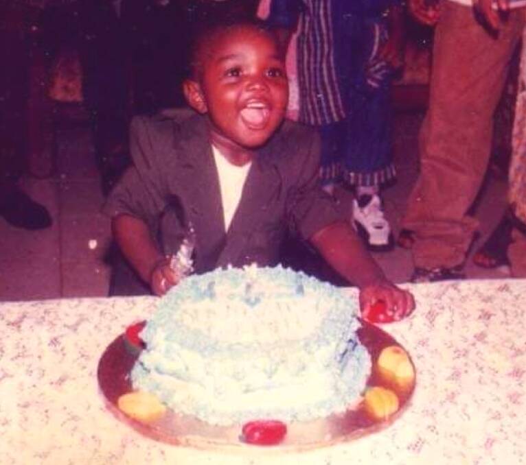 FAMILY ALBUM: Young Francis back home in Sierra Leone. The cake is as big as him.