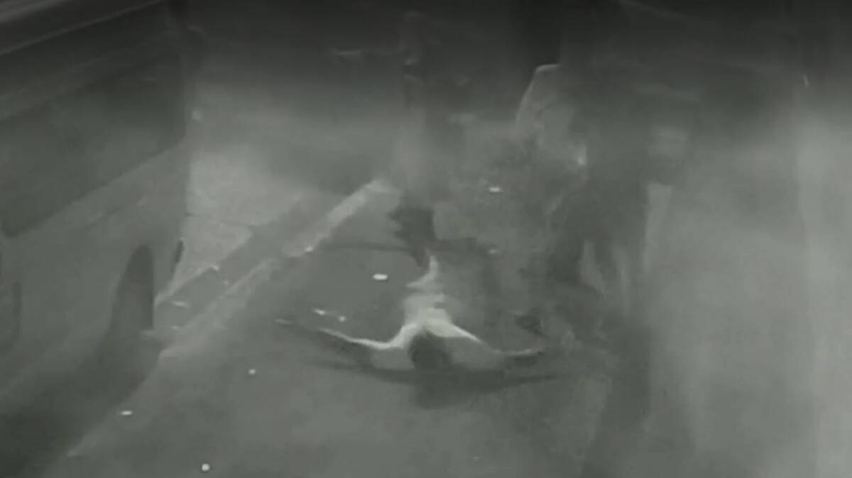 Footage: A still from CCTV vision captured just after Dane Cordner (standing) struck Jacob Saifiti (on the ground) outside the Greenroof Hotel at Hamilton.