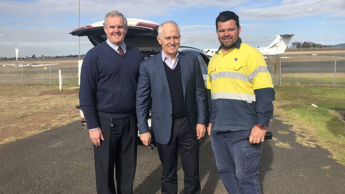 'Severe' drought: Upper Hunter Shire Council general manager Steve McDonald, Prime Minister Malcolm Turnbull and Scone Airport's Wes Suckley. Mr Turnbull and Mr McDonald spoke about dry conditions in the Hunter.