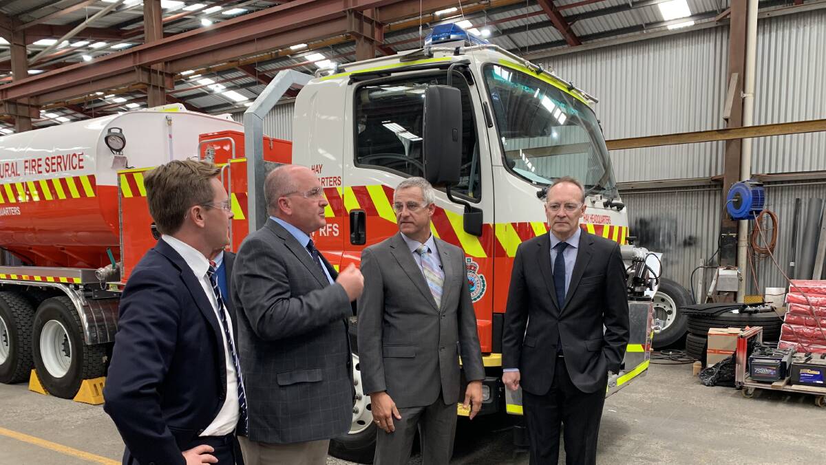 Innovation: NSW emergency services minister David Elliott (second from left) tours the Varley Group's Tomago manufacturing facility on Tuesday.