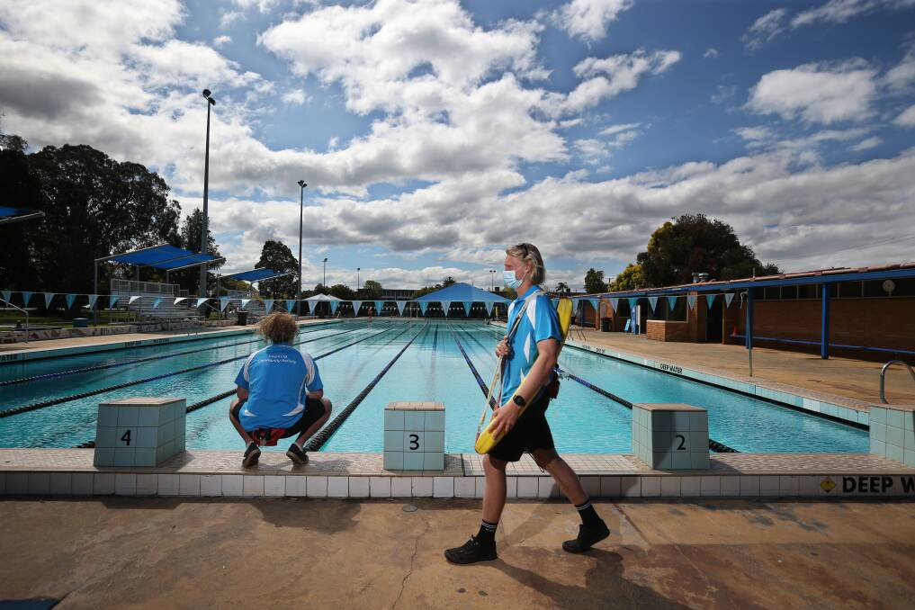 Lifeguards at Mayfield pool on Monday. Picture: Simone De Peak
