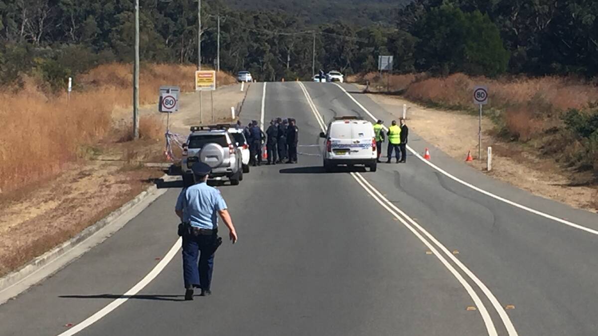 Police prepare to search the scene at Oakdale Drive, about 200 metres from the Redhead Road intersection. 