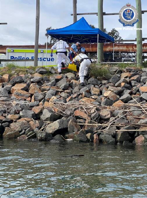 Investigators at the scene after the Brazilian national's body was found alongside bricks of cocaine. Picture: NSW Police