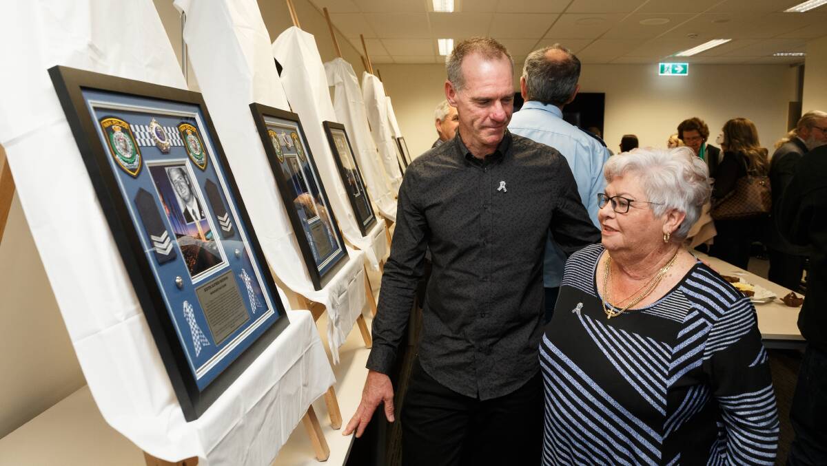Honoured: Sergeant Keith Haydon's son Peter and wife Anne at the remembrance ceremony at Belmont Police Station on Tuesday. Sergeant Haydon was shot and killed in the line of duty in 1980. Picture: Max Mason-Hubers