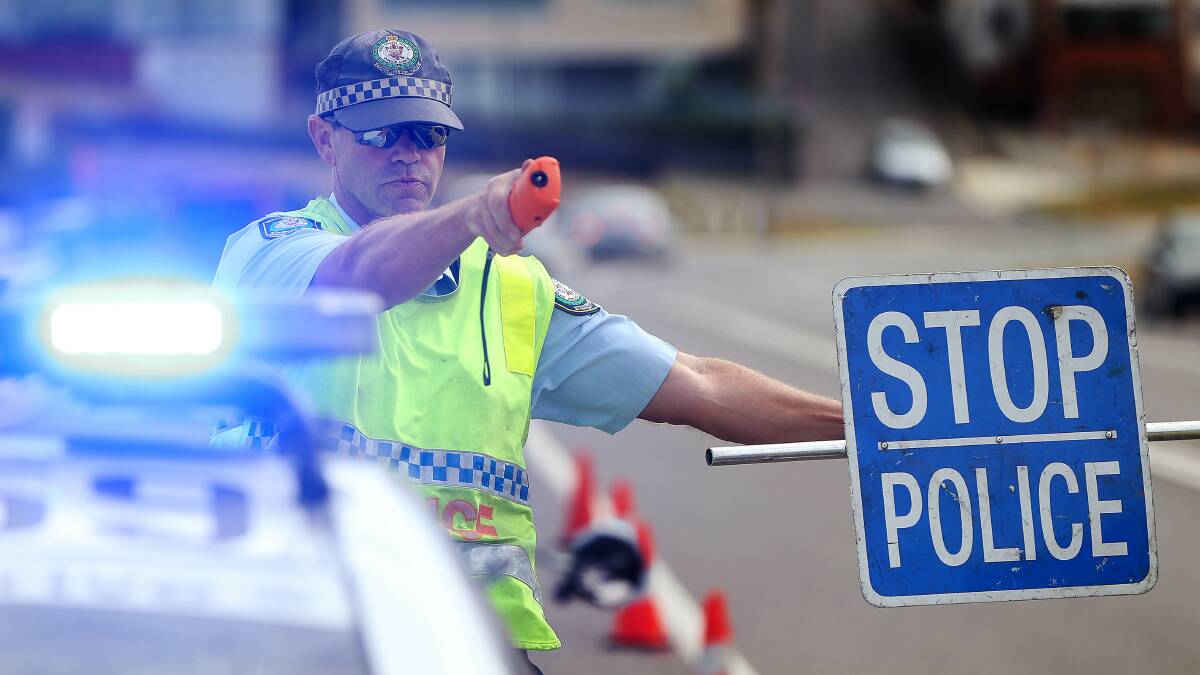 On the lookout: Police conduct random breath tests at Merewether in January. Picture: Marina Neil