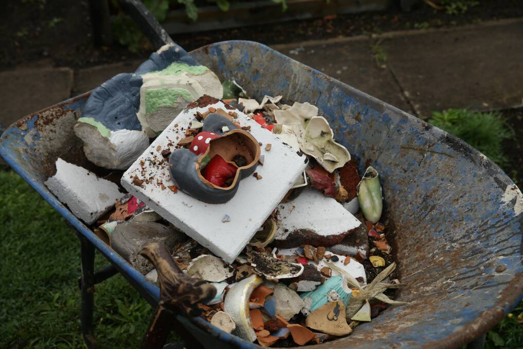 Rubble: The vandals smashed more than 20 gnomes and ornaments in the well-known yard near Belmont 16s.