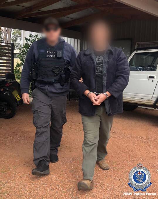 Alan James Cumberland, 44, being arrested at Medowie this week. Picture: NSW Police