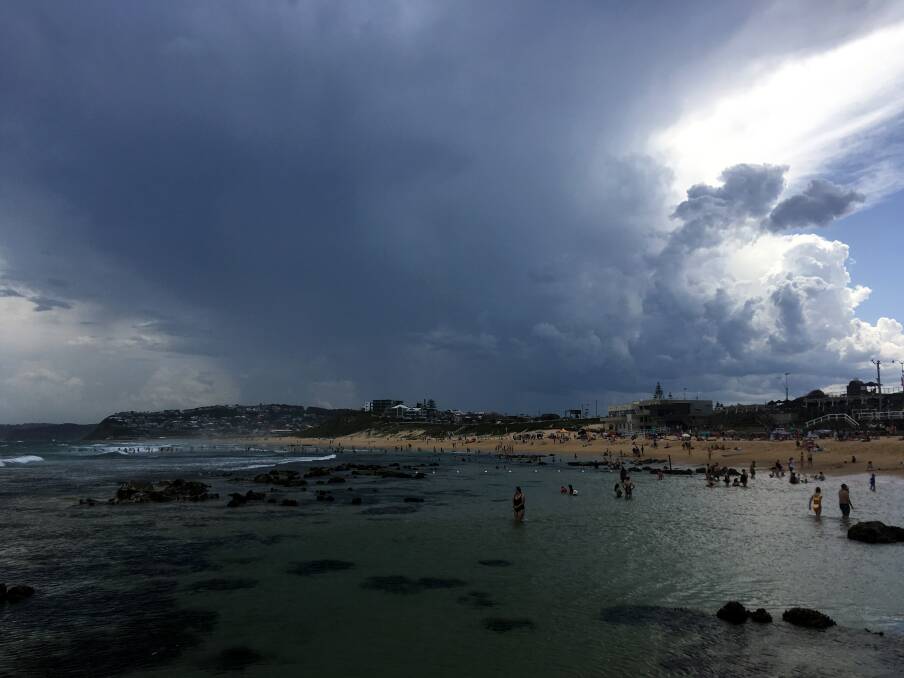 Looking back: Clouds looming over Bar beach on Australia Day. Picture: Dave Anderson