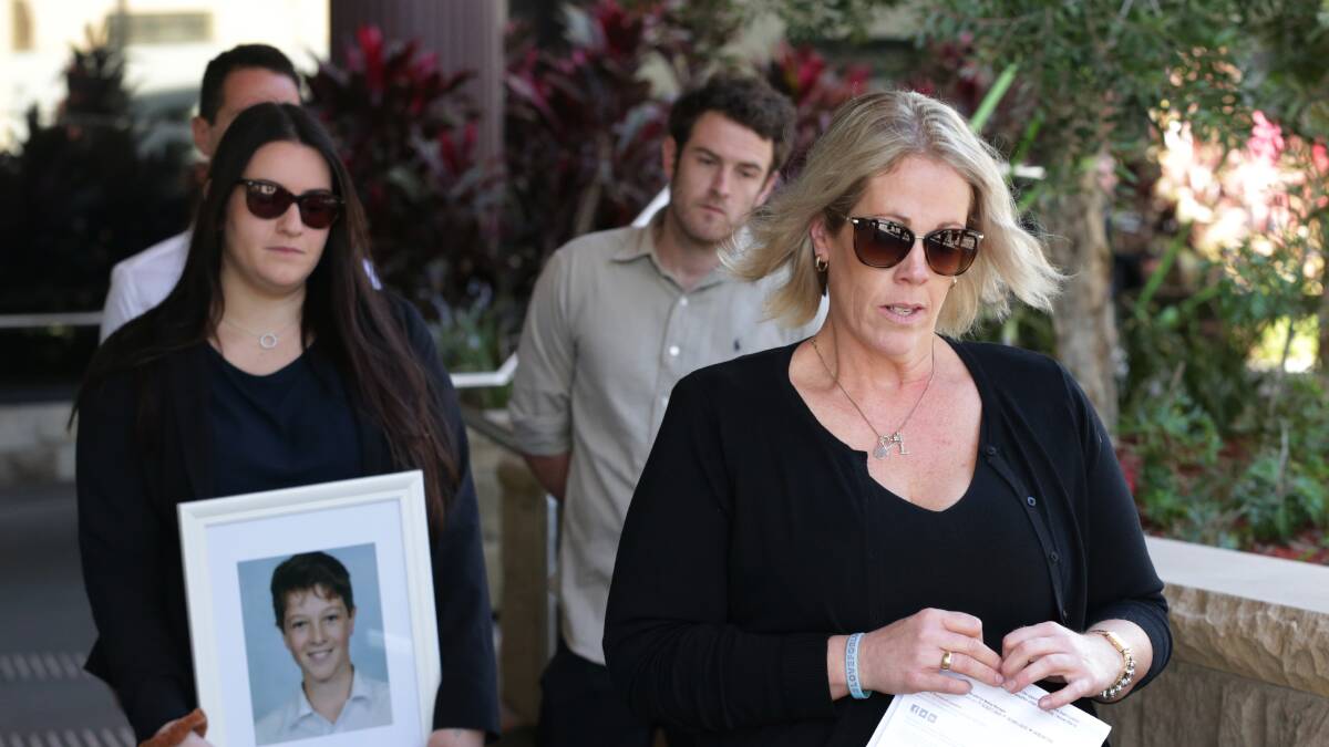 Mourning: Luca Raso's mother Michelle Degenhardt with three of his siblings. Picture: Simone De Peak