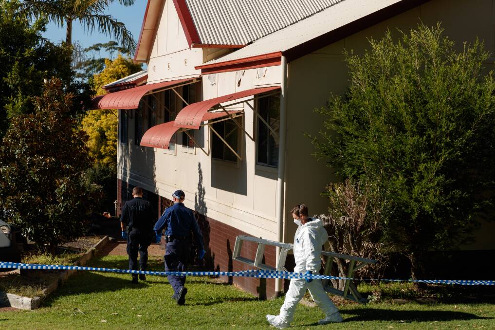 Forensic investigators search a home at Lambton Road, Waratah on Tuesday. Picture: Max Mason-Hubers