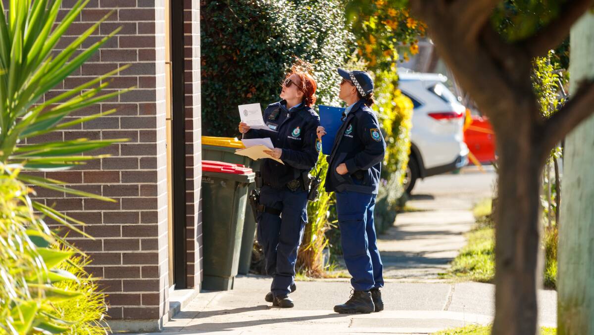 Follow-up: Police continued to door-knock and search for clues at Stockton on Friday. Picture: Max Mason-Hubers