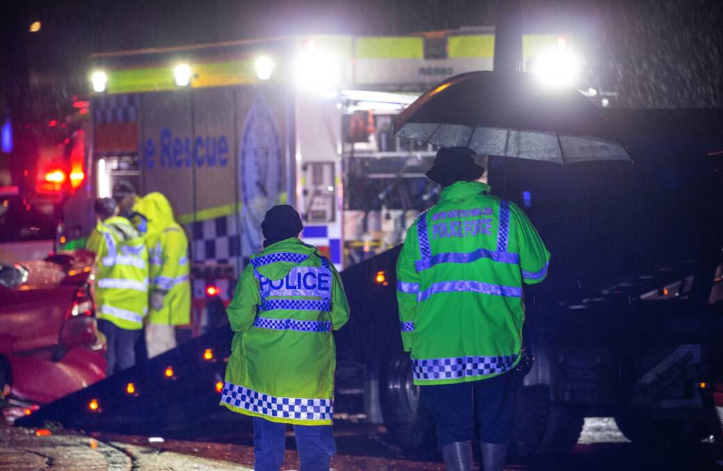 Police at the scene of a fatal crash at Cardiff last year. Picture by Marina Neil