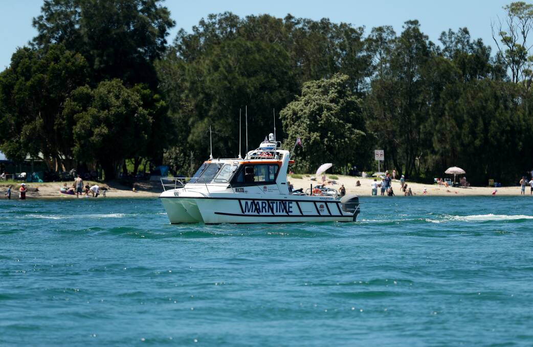 A NSW Maritime vessel on patrol on Lake Macquarie. Picture: Jonathan Carroll