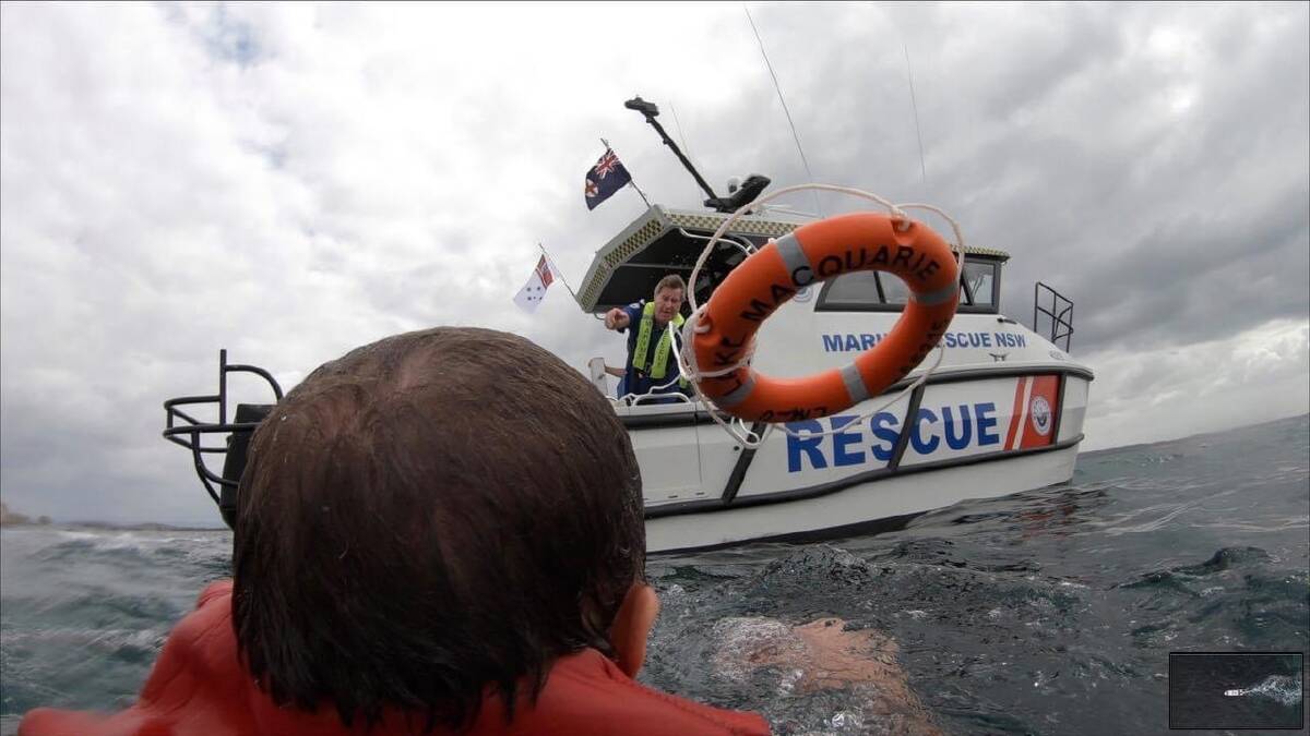 Help at hand: A buoy being tossed during a previous exercise. Pictures: Marine Rescue Lake Macquarie