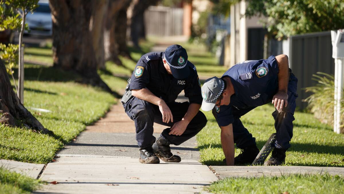 Police conduct a search for a firearm on Buruda Street where there was an early-morning shooting. Mayfield West, Newcastle. Pictures: Max Mason-Hubers