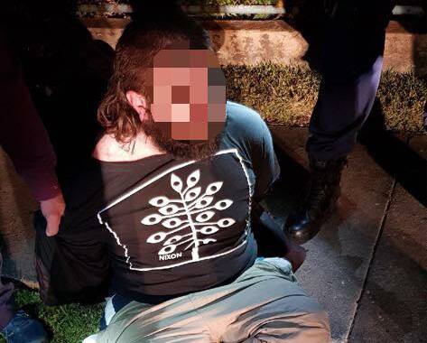 Police arrest a man at Waratah in the early hours of Monday. Picture: NSW Police