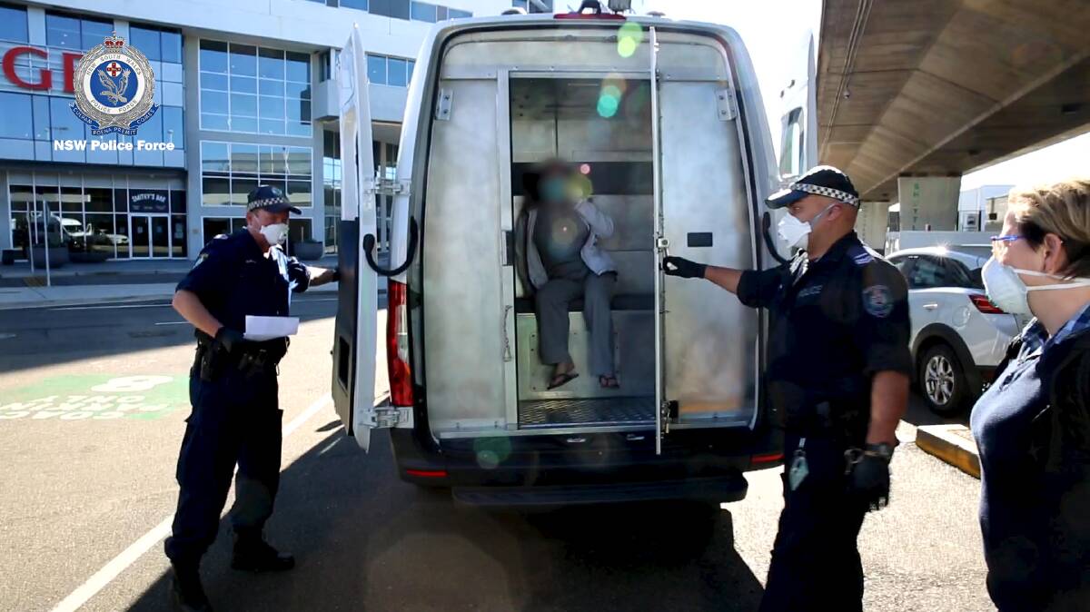 Police extraditing a woman charged over the alleged murder of 71-year-old Robert Dickie. Picture: NSW Police