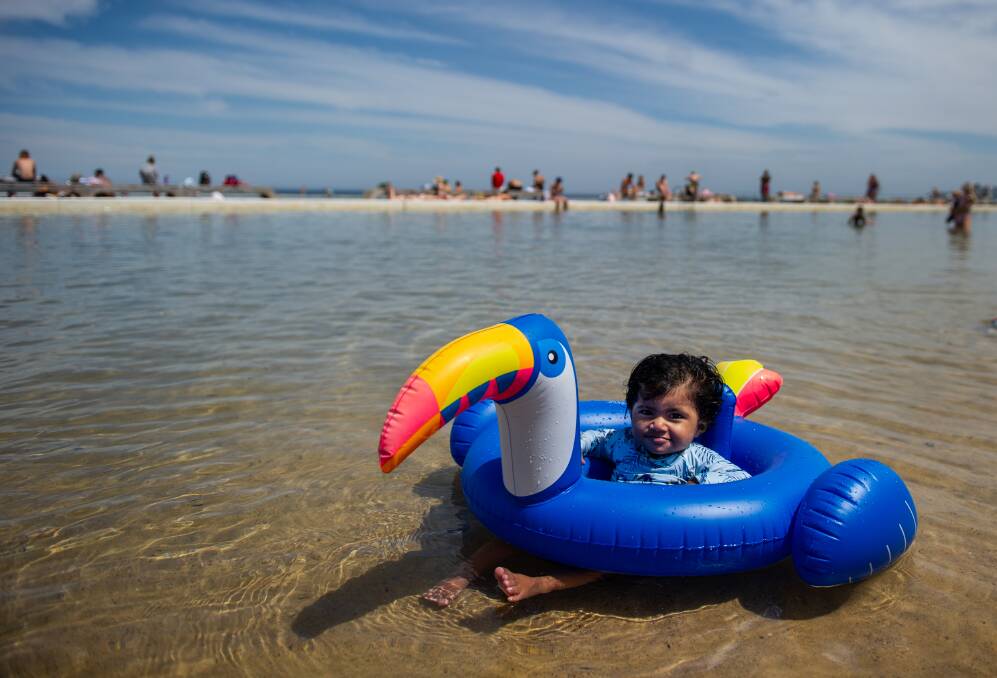 Birthday girl: Imama Akbar of New Lambton - who turned 1 on Sunday - cooling off at Merewether on Monday. Picture: Marina Neil