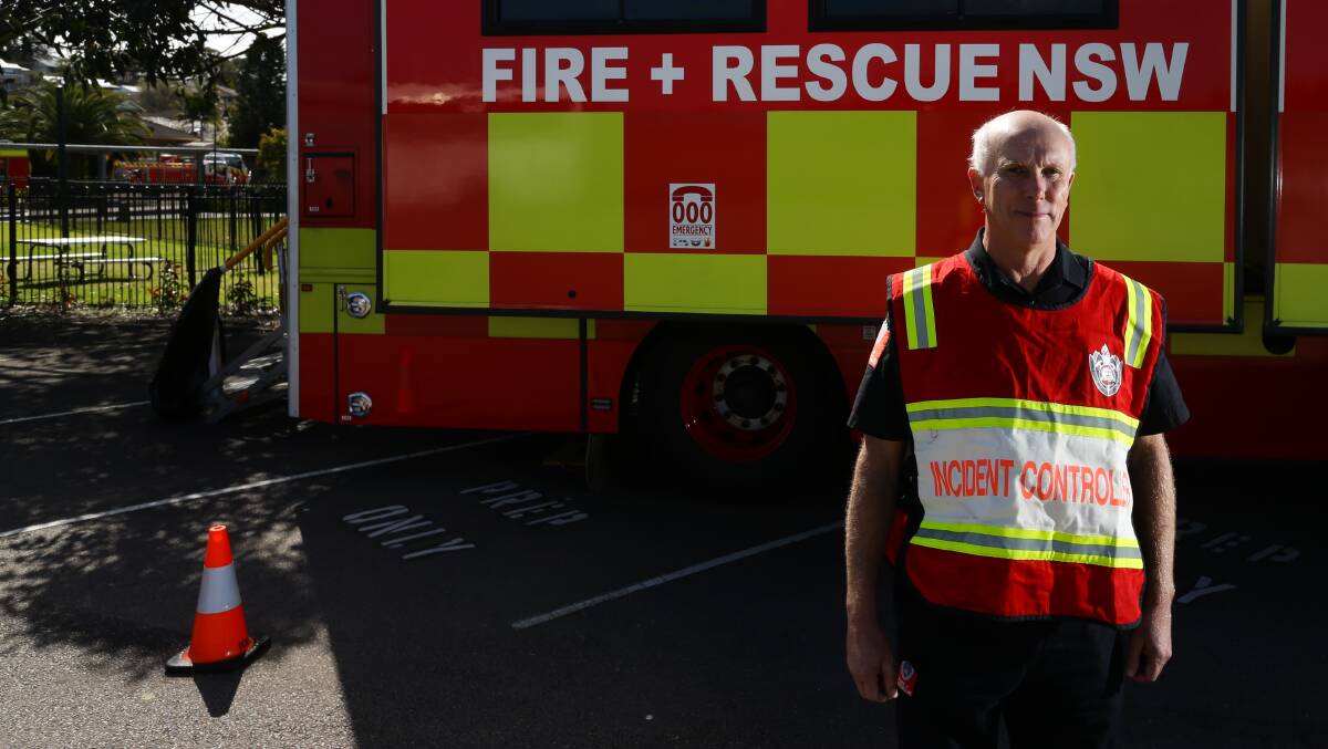 Aftermath: Fire and Rescue NSW acting Superintendent Greg Windeatt at the staging area on Friday. Picture: Jonathan Carroll