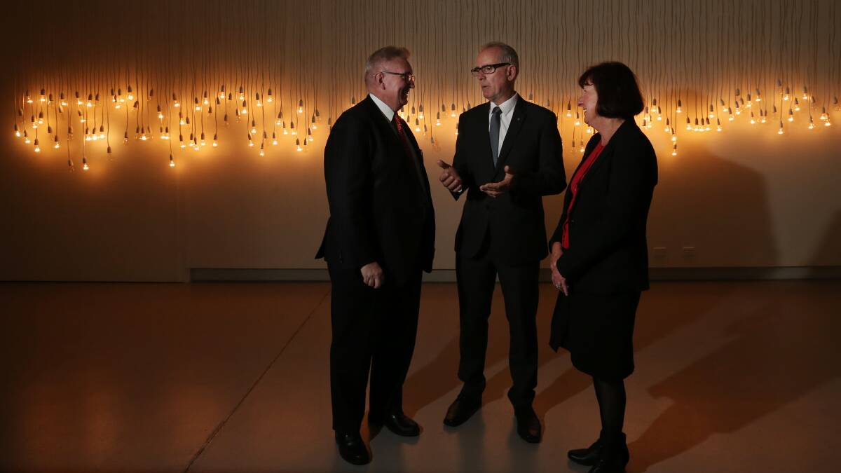 Big plans: Arts Minister Don Harwin, state MP Greg Piper and mayor Kay Fraser with a Jonathan Jones piece called '68 Fletcher, Bondi, 20:20, 8.6.03'. Picture: Simone De Peak