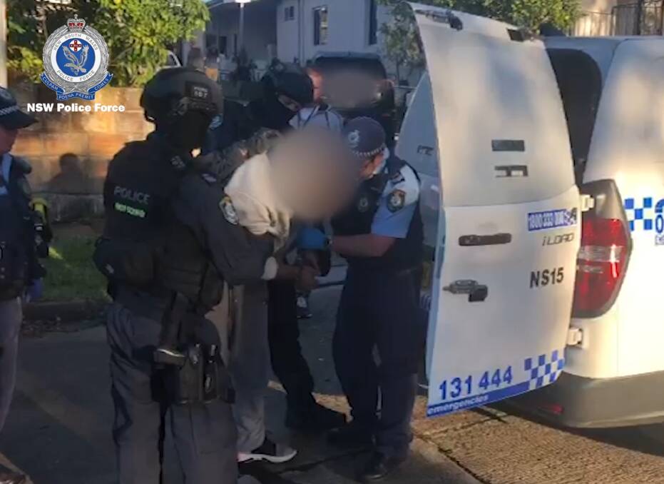 In custody: A man is arrested at Chatswood on Tuesday morning. Picture: NSW Police