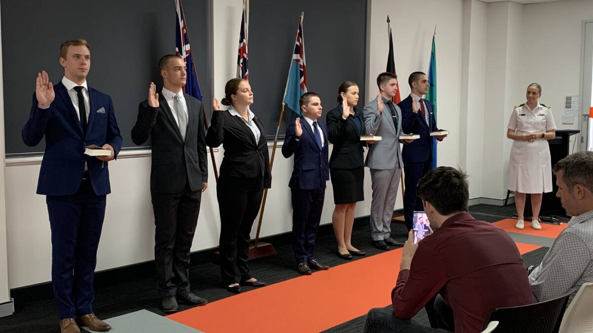 Pride: Newly recruited Australian Defence Force cadet officers make their pledge in Newcastle on Tuesday.