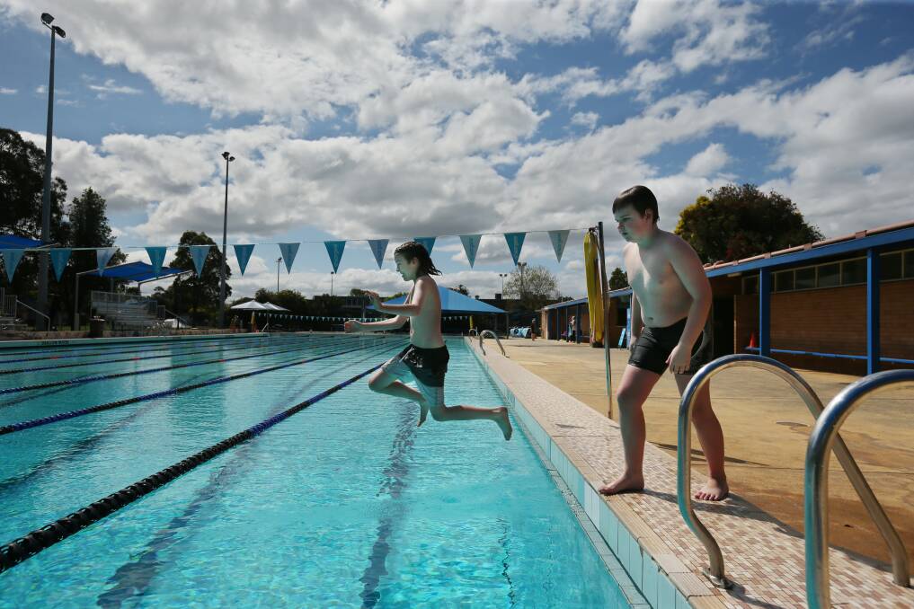 Back into it: Jake Stanes, 10, and Jackson Bogacz, 10, enjoy an outing at Mayfield Swimming Centre on Monday. Picture: Simone De Peak 