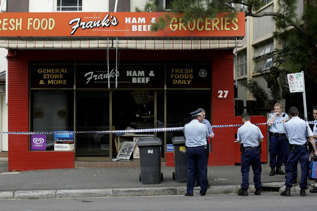 Police outside the shop after Mr Newbery was killed in 2007. Picture: Simone De Peak