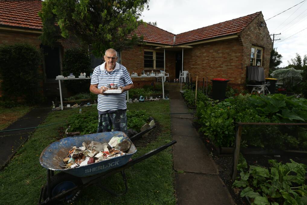 Heartless: Jacko with debris from about 25 of his beloved gnomes on Tuesday. Picture: Jonathan Carroll