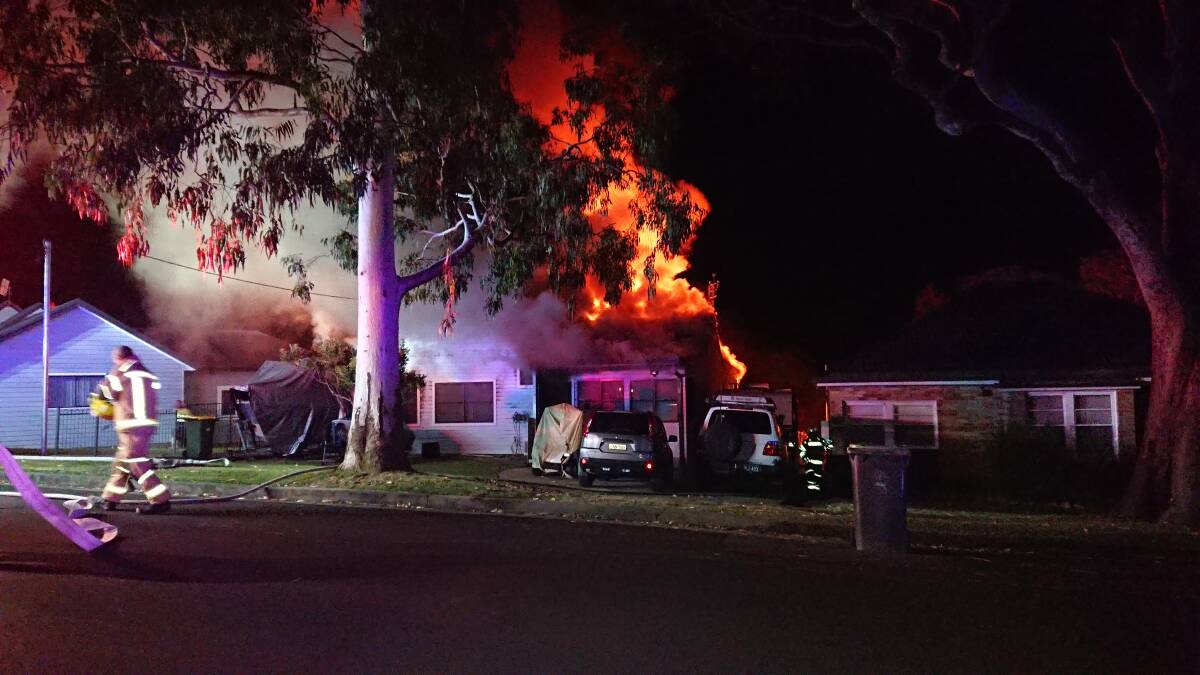 Inferno: Homeowner Ray Jolliffe was pulled from the house as he tried to fight the fire with a garden hose. Picture: Mark O'Toole