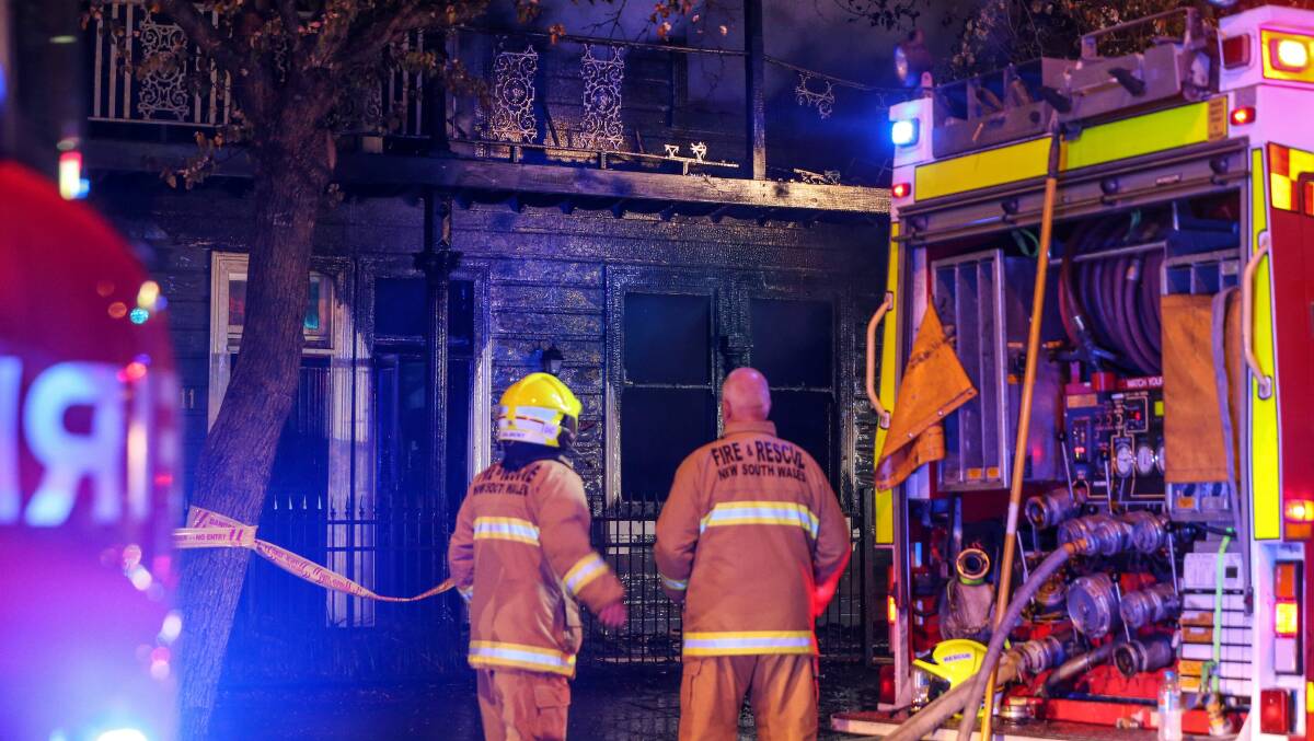 Emergency crews respond to a fire at a terrace house in Beaumont Street, Hamilton. Pictures: Marina Neil
