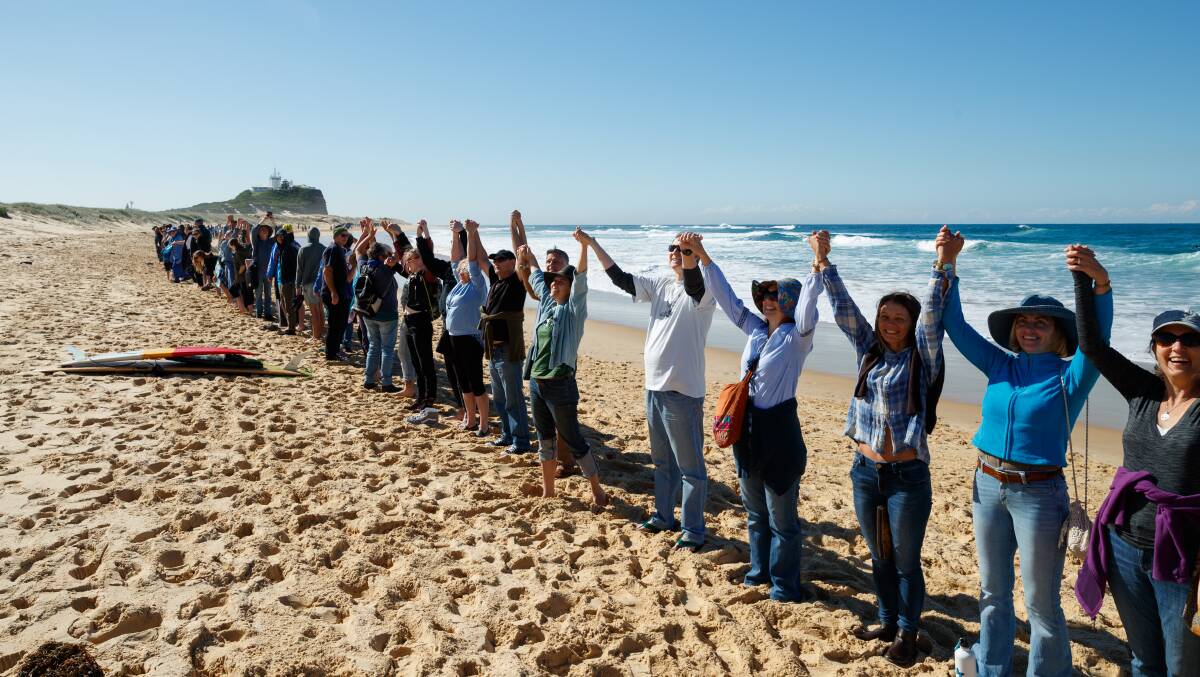 Community action: Protestors at Nobbys Beach during one of several rallies held against seismic testing off the east coast last year. Picture: Max Mason-Hubers