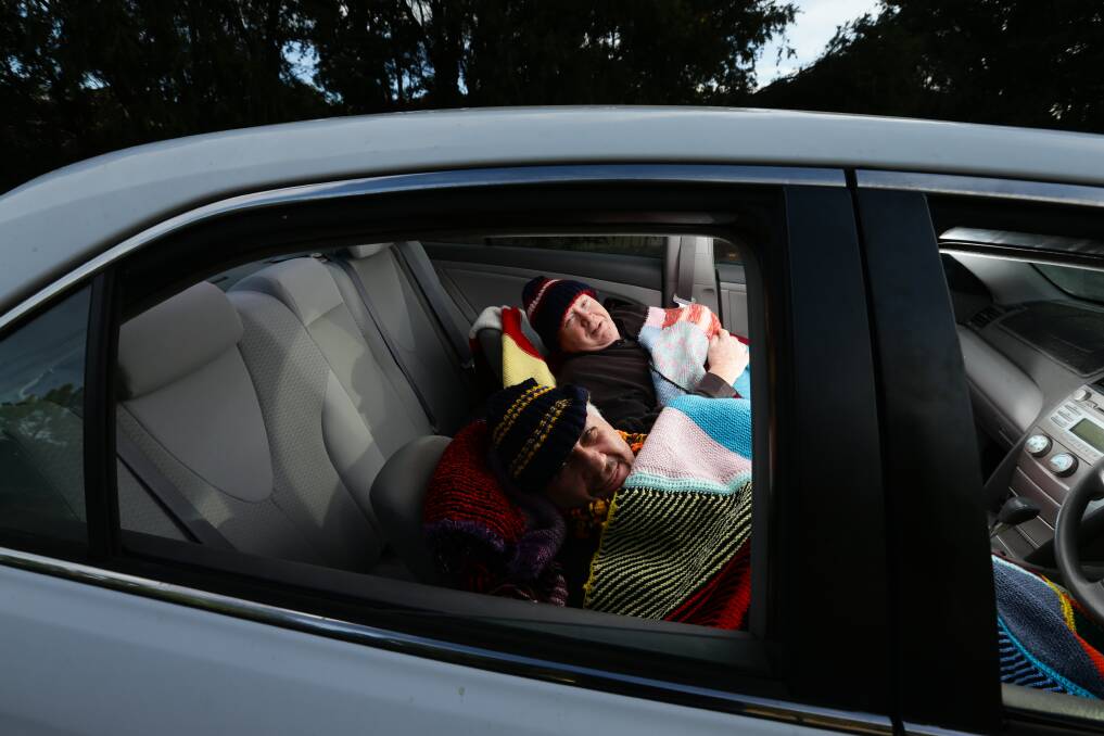 Sleeping out: Peter Di Girolamo and Bruce Andrews rugged up in a car ahead of Night Under The Stars. Picture: Jonathan Carroll