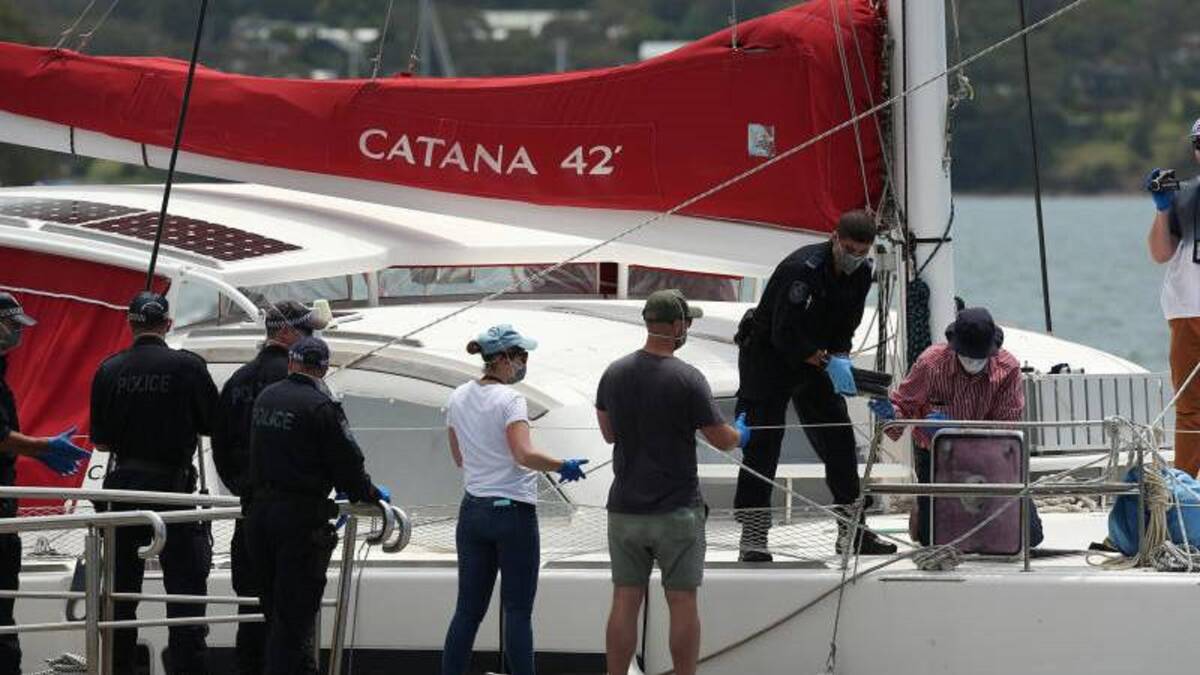 HIGH SEIZE: Police unload 700 kilograms of cocaine from the hull of the catamaran. 