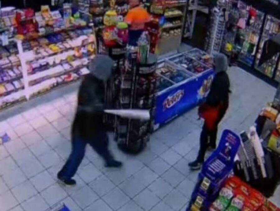 TERRIFYING: The father and son during an armed robbery at a Williamtown service station in May, 2020. 