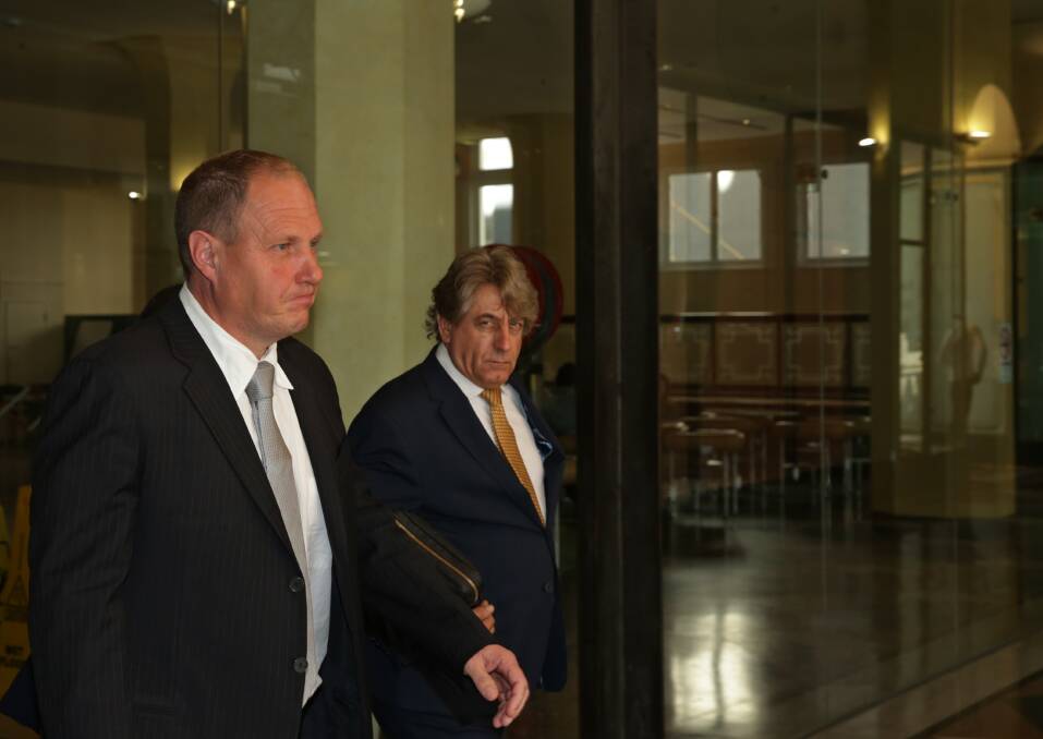 FREE: Lemuel John Page leaves Sydney's Downing Centre with his solicitor, Brett Galloway, ahead of his appeal hearing on Wednesday. Page's was re-sentenced to a 12-month suspended jail term. Picture: Simone De Peak 
