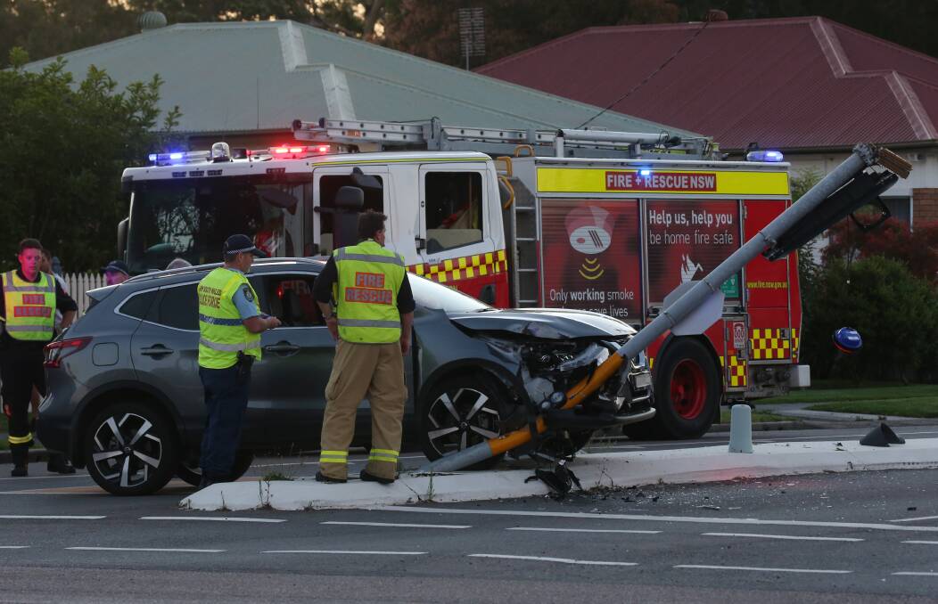 CRASH: Police said the Nissan Qashqai was speeding away from a highway patrol car when the woman crashed into a set of traffic lights. 