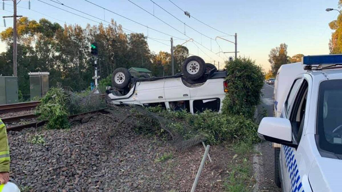 CRASH: The Landcruiser that was found upside down on the railway line. The alleged driver, Thomas Henry White, was in court on Tuesday. Picture: Dora Creek Rural Fire Brigade