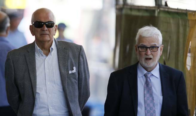 ACCUSED: Former Anglican Dean Graeme Lawrence, left, and his solicitor John Anthony heading into Newcastle courthouse in December. Picture: Darren Pateman

