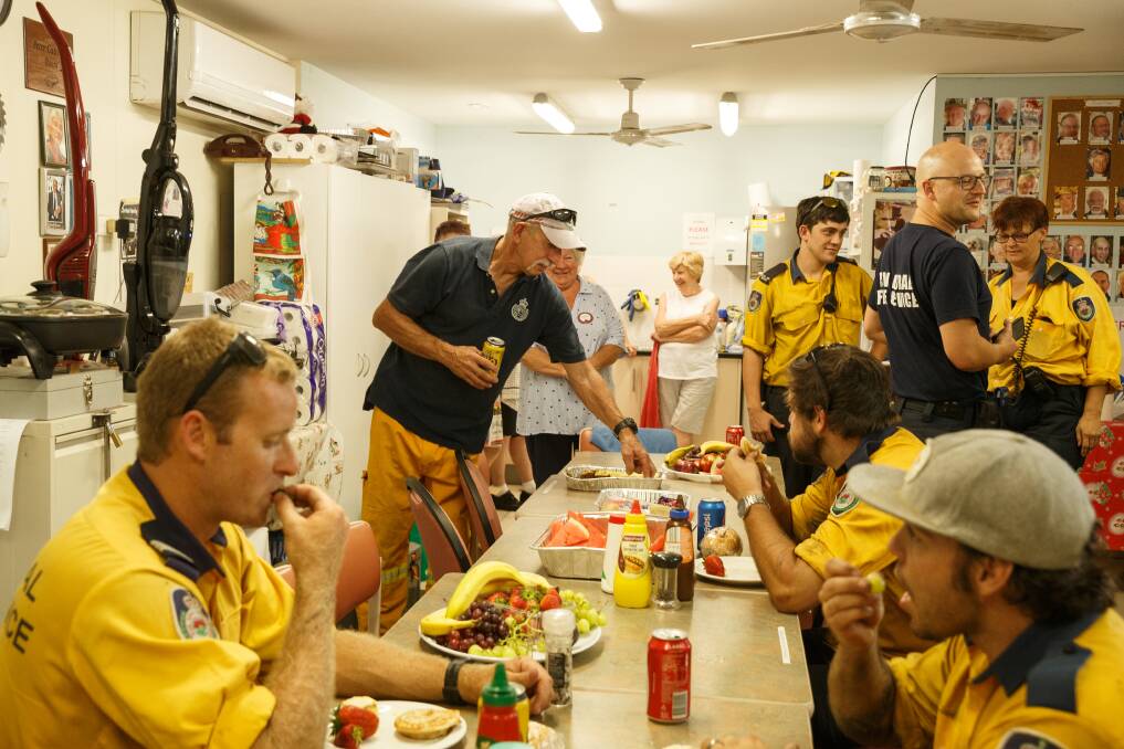 THANK YOU: The Wangi Lions Club and Wangi Men's Shed put on a lunch for NSW RFS firefighters battling the nearby Summerhill Drive blaze. Picture: Max Mason-Hubers 