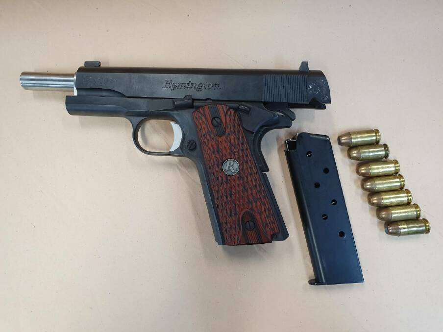 Police say they also seized a loaded Remington semi-automatic pistol. 