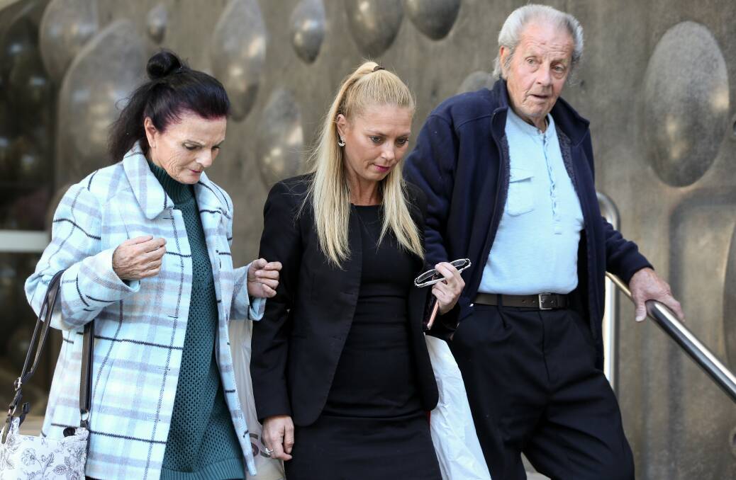 APPALLING: Katrina Marie Baker, 40, (middle, dressed in all black) crashed her car on the way to pick up her daughter from school. She had a blood alcohol reading of 0.296. On Thursday she pleaded guilty to high-range drink-driving and avoided a jail term. Picture: Marina Neil 