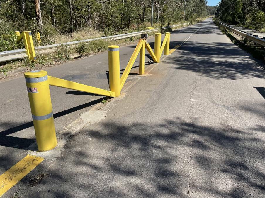 The concrete bollards in the middle of HEZ Drive. Lawyers for the teenage driver who caused the crash said the bollards represented "a very significant hazard". 