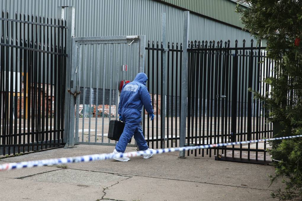 INVESTIGAITON: Police searching the industrial site at Cardiff on Thursday. Picture: Marina Neil