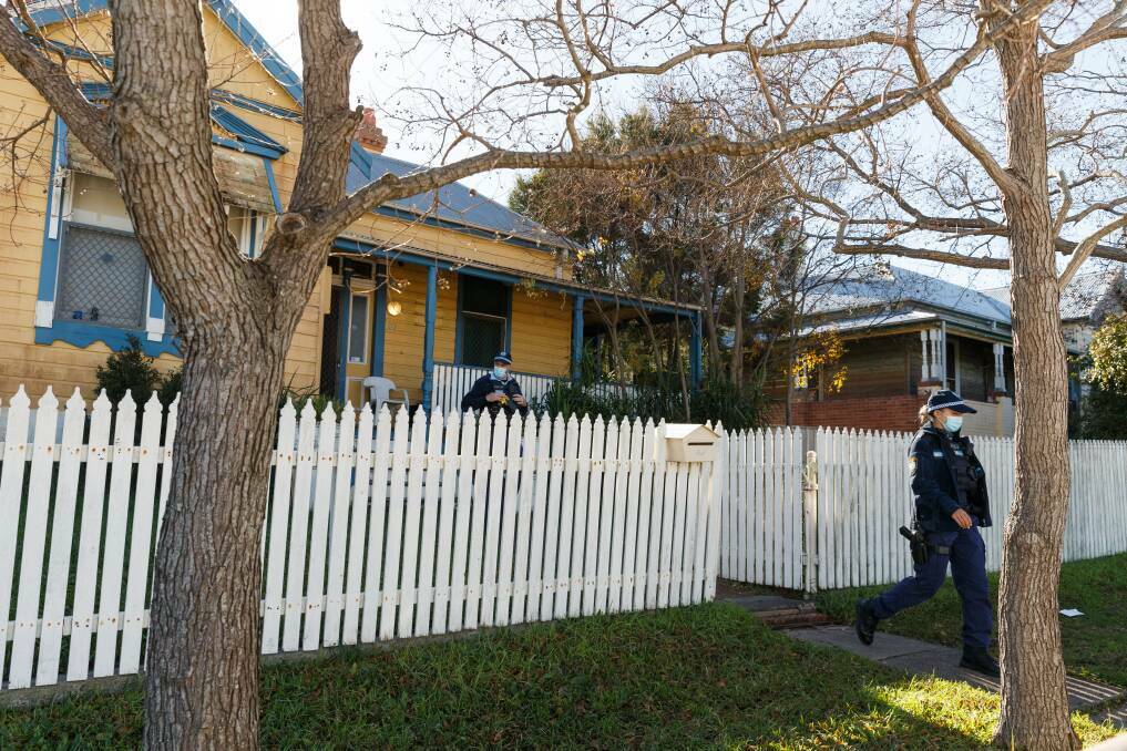 Specialist crime scene police examining the boarding house in Mayfield after the discovery of Mr O'Sullivan's body. Picture by Max Mason-Hubers 
